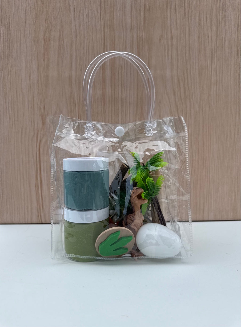 Dino Playpack Bag - clear travel tote with dino dough jars, dinosaur figure, stamp and tools